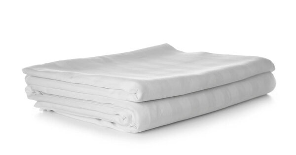Stack of clean bed sheets on white background