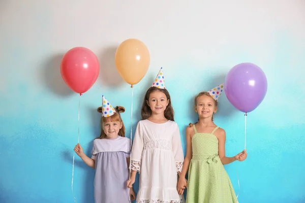 Cute Little Children Birthday Hats Balloons Color Background — Stock Photo, Image