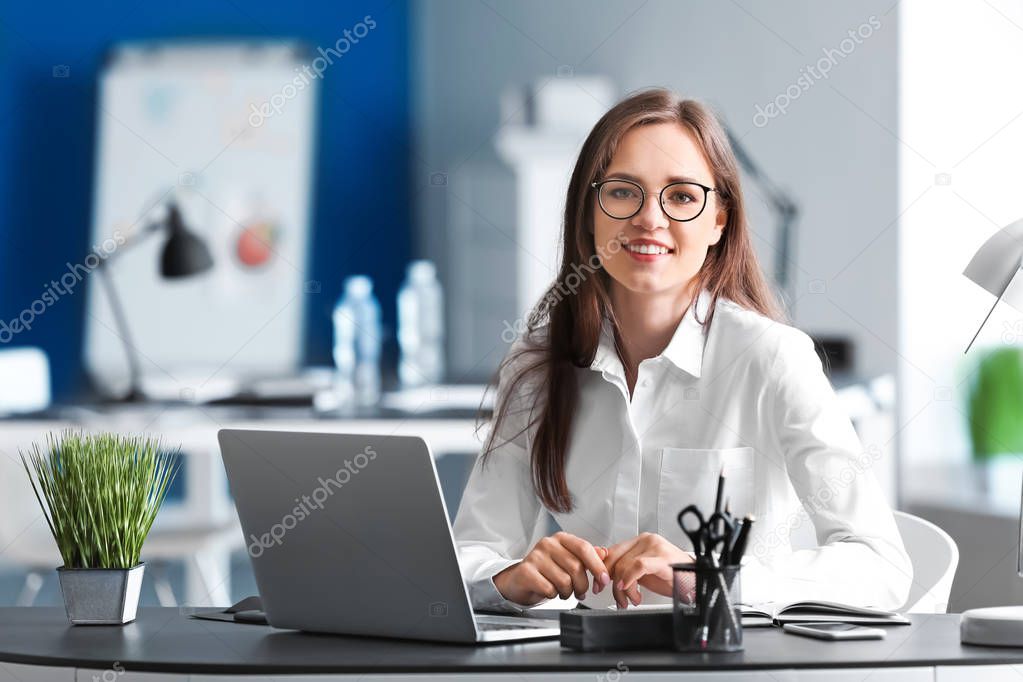 Young businesswoman working in office