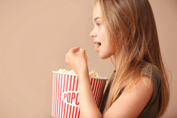 Cute Little Girl Eating Popcorn Color Background — Stock Photo, Image