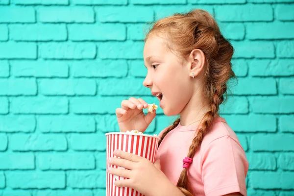 Cute Little Girl Eating Popcorn Brick Wall — Stock Photo, Image