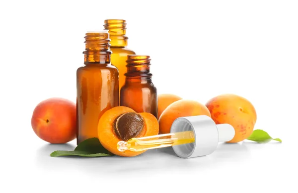 Bottles Essential Oil Fresh Apricots White Background — Stock Photo, Image
