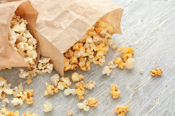 Paper Bags Scattered Delicious Popcorn Wooden Background Closeup — Stock Photo, Image