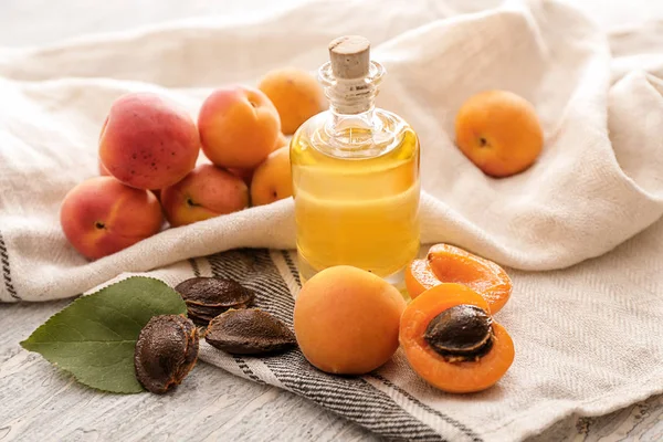 Bottle Essential Oil Fresh Apricots Table — Stock Photo, Image