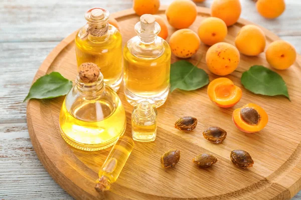 Bottles Apricot Essential Oil Wooden Board — Stock Photo, Image