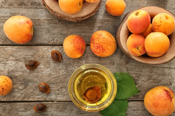 Bowl Essential Oil Fresh Apricots Wooden Table — Stock Photo, Image