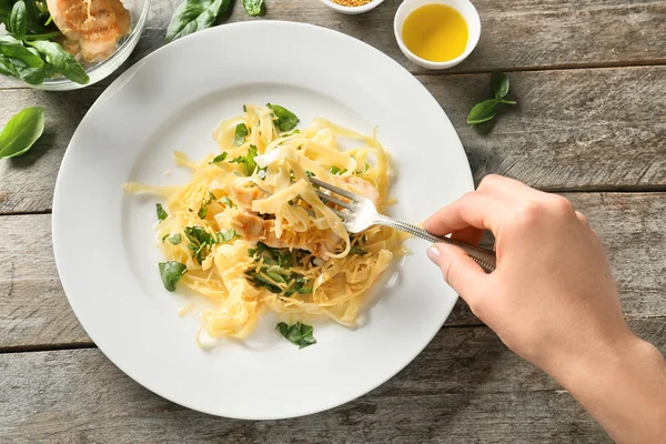 Woman Eating Delicious Pasta Chicken Fillet Cheese Table — Stock Photo, Image