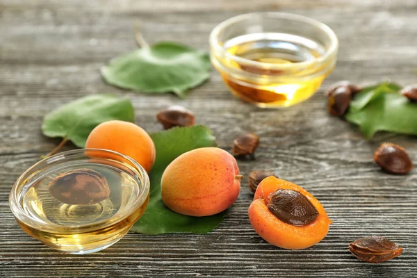 Bowls Essential Oil Fresh Apricots Wooden Table — Stock Photo, Image