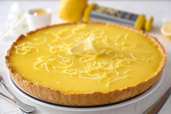 Tasty lemon pie on table, closeup