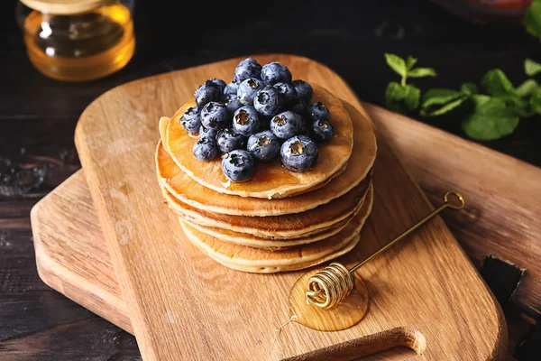 Board Tasty Pancakes Honey Dipper Blueberries Wooden Table — Stock Photo, Image