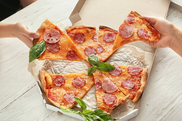 Young People Taking Slices Tasty Pizza Box Wooden Table — Stock Photo, Image