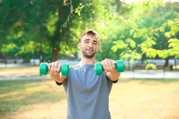 Sporty Young Man Training Dumbbells Outdoors — Stock Photo, Image