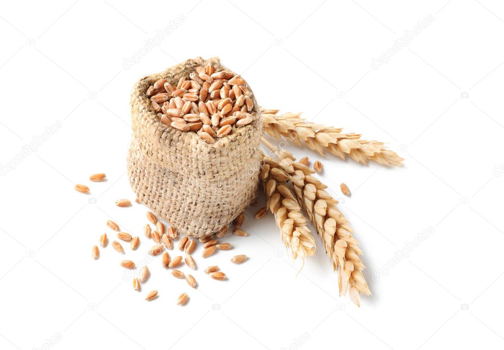 Bag with wheat grains on white background