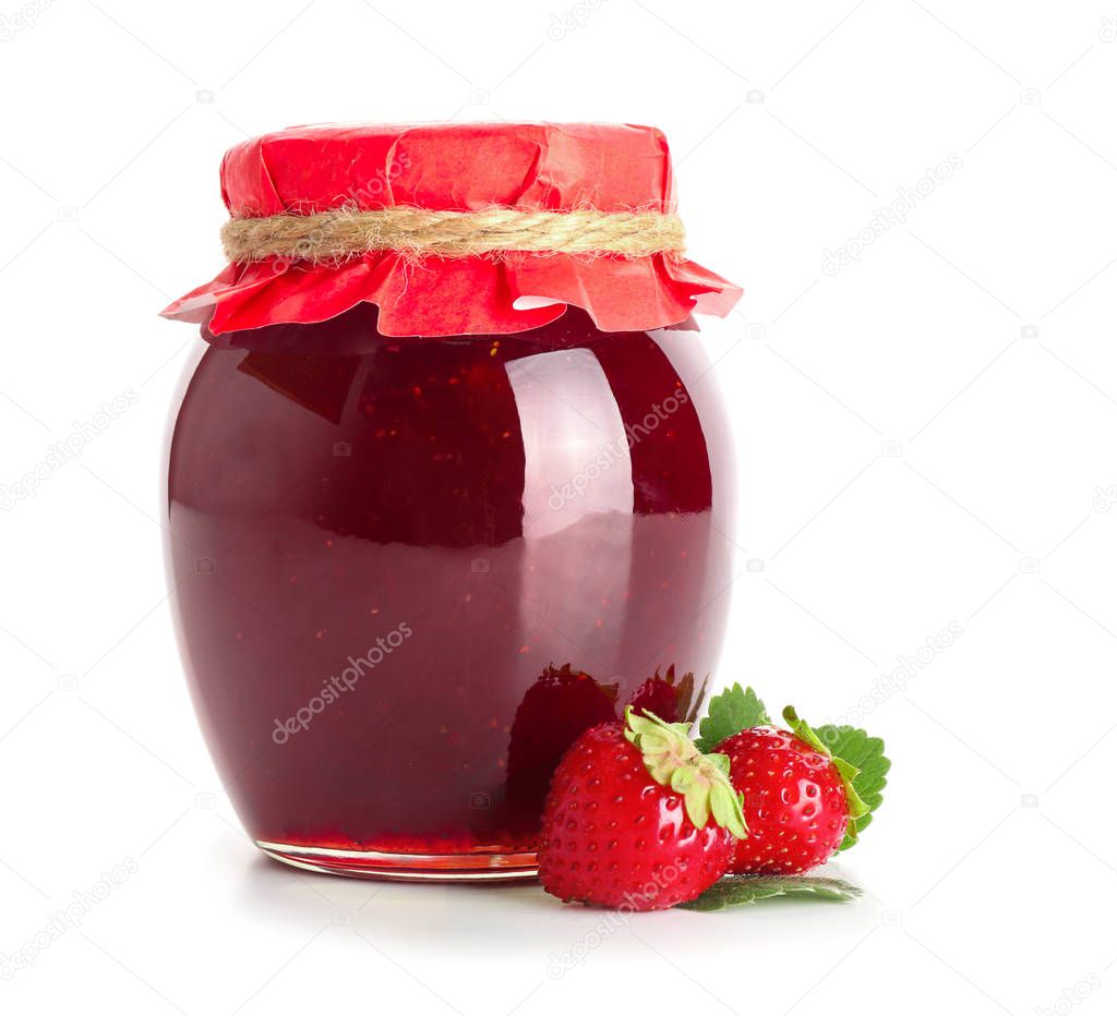 Glass jar with delicious strawberry jam on white background
