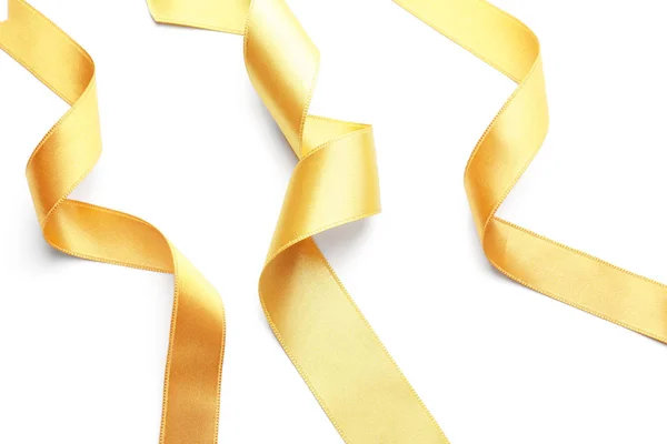 Curled Golden Ribbons White Background — Stock Photo, Image