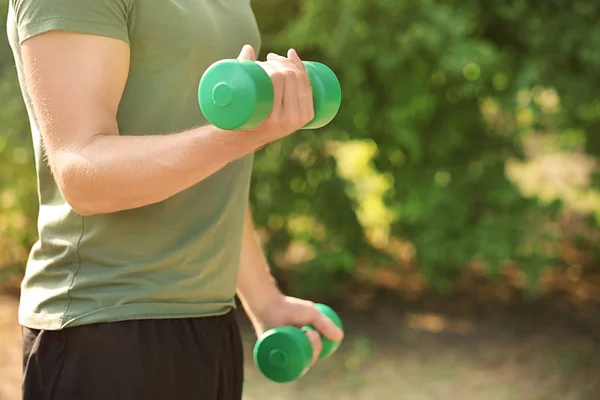 Sporty Young Man Training Dumbbells Outdoors — Stock Photo, Image