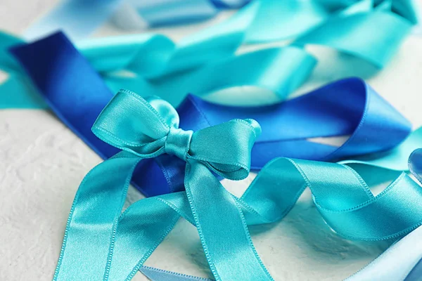 Blue Satin Ribbons Light Table Closeup — Stock Photo, Image