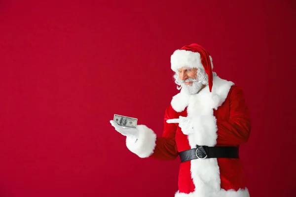 Санта Клаус Долларовыми Банкнотами Цветном Фоне — стоковое фото