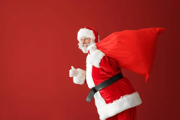 Running Santa Claus Bag Full Gifts Color Background — Stock Photo, Image