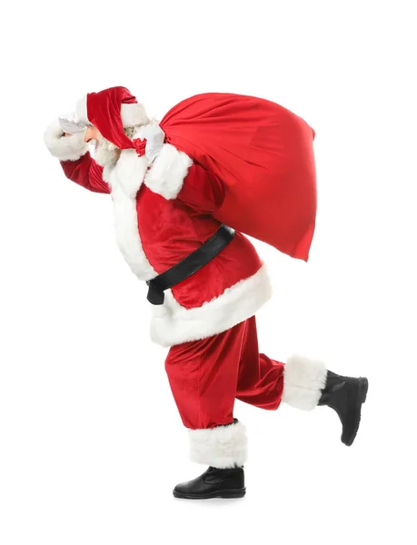 Laufender Weihnachtsmann Mit Tasche Voller Geschenke Auf Weißem Hintergrund — Stockfoto