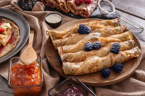 Plate Tasty Thin Pancakes Berries Jam Wooden Table — Stock Photo, Image