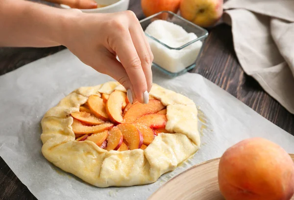 Woman Sprinkling Raw Peach Galette Sugar Closeup — Stock Photo, Image