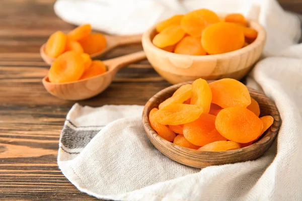 Bowls Spoons Dried Apricots Wooden Table — Stock Photo, Image