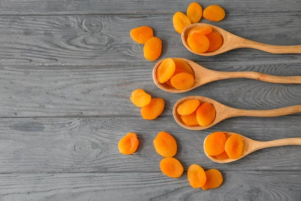 Spoons Dried Apricots Wooden Table — Stock Photo, Image