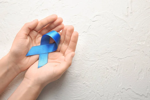 Woman Holding Blue Ribbon Light Background Cancer Concept — Stock Photo, Image