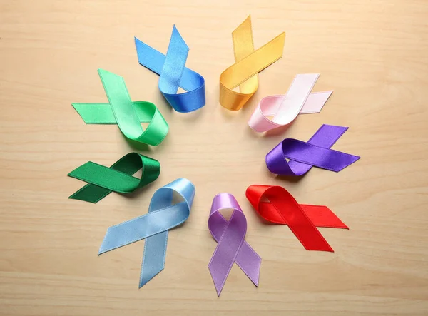 Circle Made Colorful Ribbons Wooden Background Cancer Concept — Stock Photo, Image