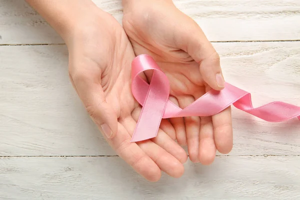 Woman Holding Pink Ribbon Wooden Background Breast Cancer Concept — Stock Photo, Image