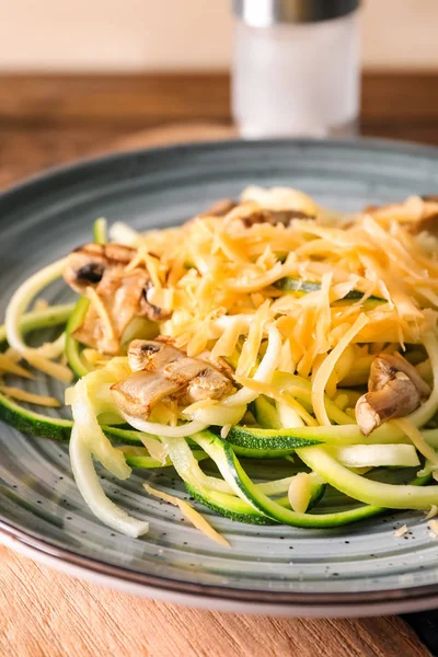 Plate Zucchini Spaghetti Mushrooms Cheese Wooden Board Closeup — Stock Photo, Image