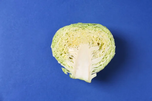 Half of cabbage on color background