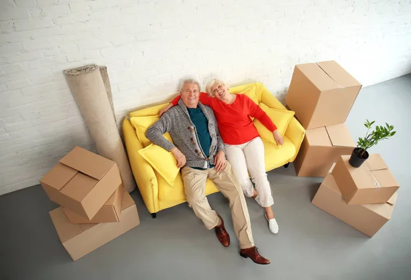 Mature Couple Sitting Sofa Boxes Moving New House — Stock Photo, Image