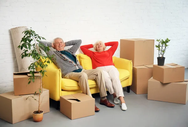 Mature Couple Sitting Sofa Boxes Moving New House — Stock Photo, Image