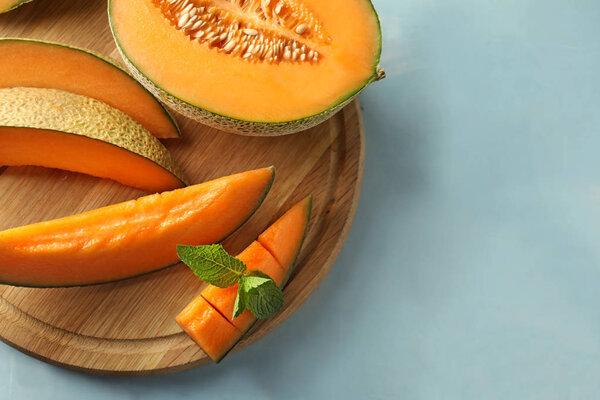 Tasty cut melon on table
