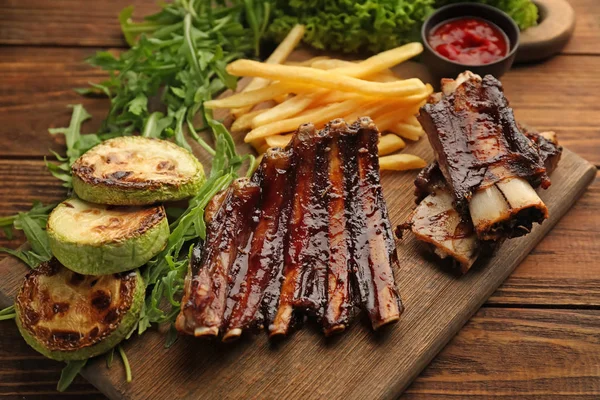 Delicious Grilled Ribs French Fries Arugula Zucchini Wooden Board — Stock Photo, Image
