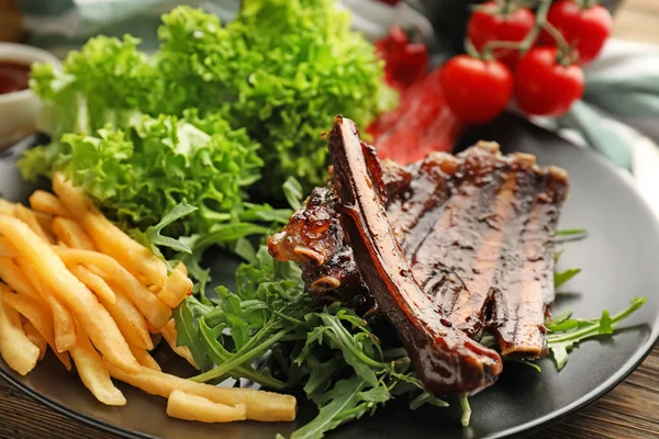 Delicious Grilled Ribs Herbs French Fries Plate Closeup — Stock Photo, Image