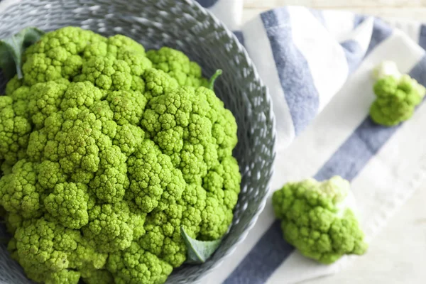 Bowl with green cauliflower cabbage, closeup