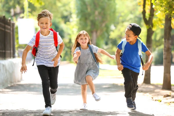 Cute Little Schoolchildren Running Outdoors — Stock Photo, Image