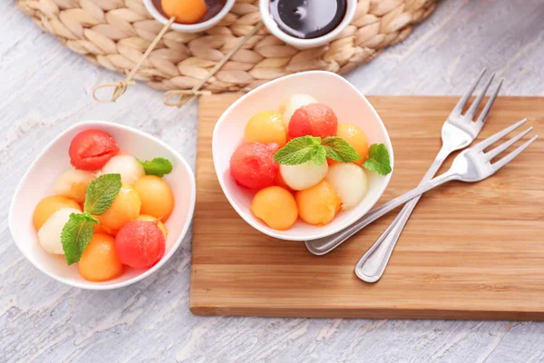 Plates Tasty Melon Dessert Wooden Table — Stock Photo, Image