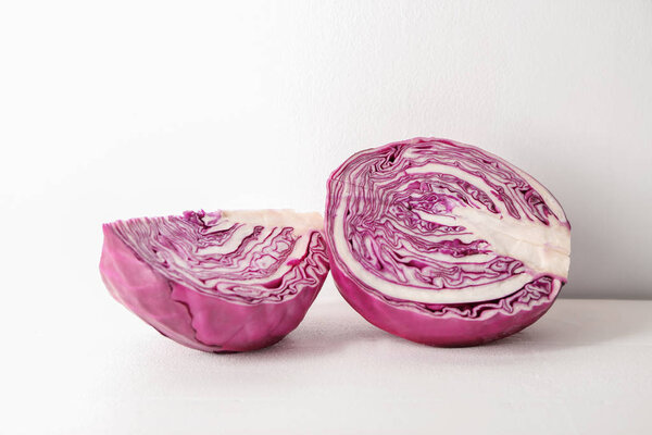 Cut red cabbage on white table