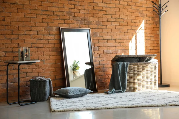 Big Stylish Mirror Wicker Baskets Table Brick Wall Room — Stock Photo, Image