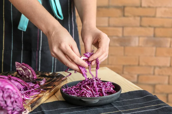 Woman Putting Cut Red Cabbage Pan Table — Stock Photo, Image