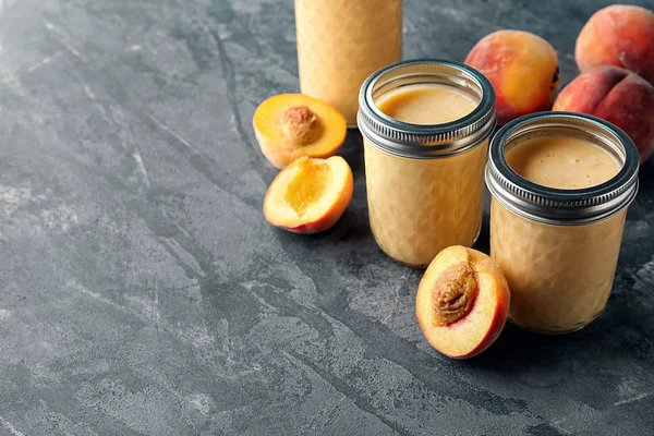Jars Fresh Peach Smoothie Grey Table — Stock Photo, Image