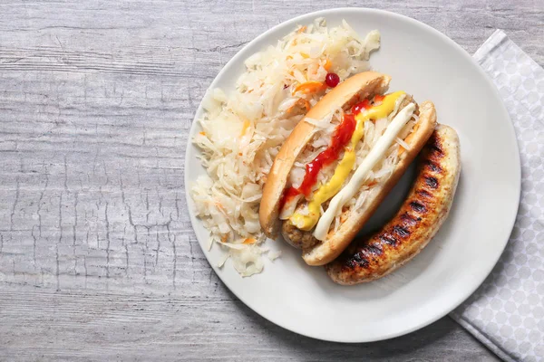 Plate Tasty Hot Dog Sauerkraut Grey Table — Stock Photo, Image