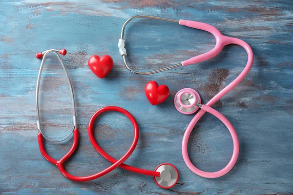 Medical Stethoscopes Red Hearts Wooden Background Cardiology Concept — Stock Photo, Image