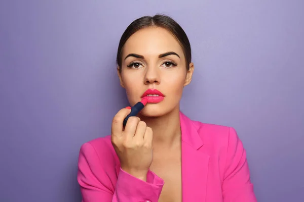 Beautiful Young Woman Applying Bright Lipstick Color Background — Stock Photo, Image