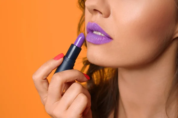 Beautiful Young Woman Applying Lilac Lipstick Color Background Closeup — Stock Photo, Image