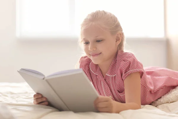 Cute Little Girl Reading Book Bed Home — Stock Photo, Image